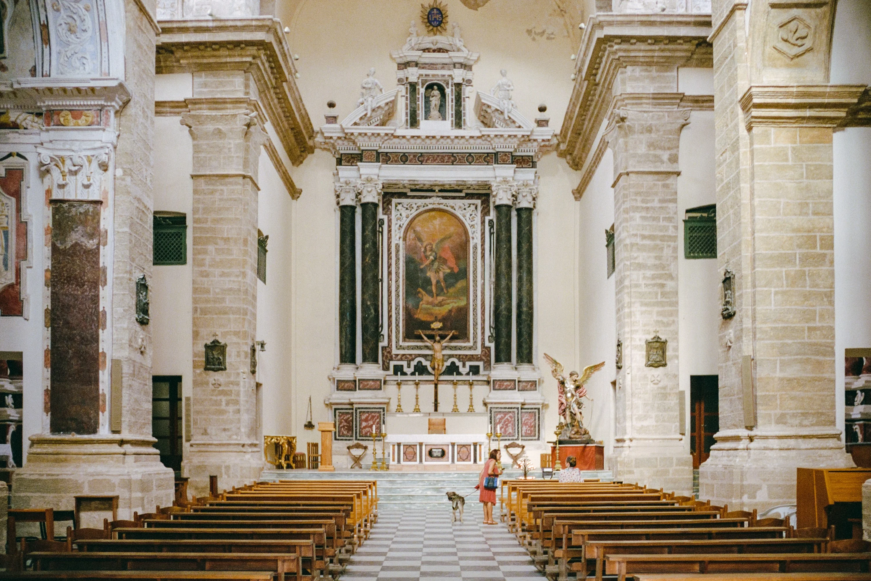 A church nave with a painted altar