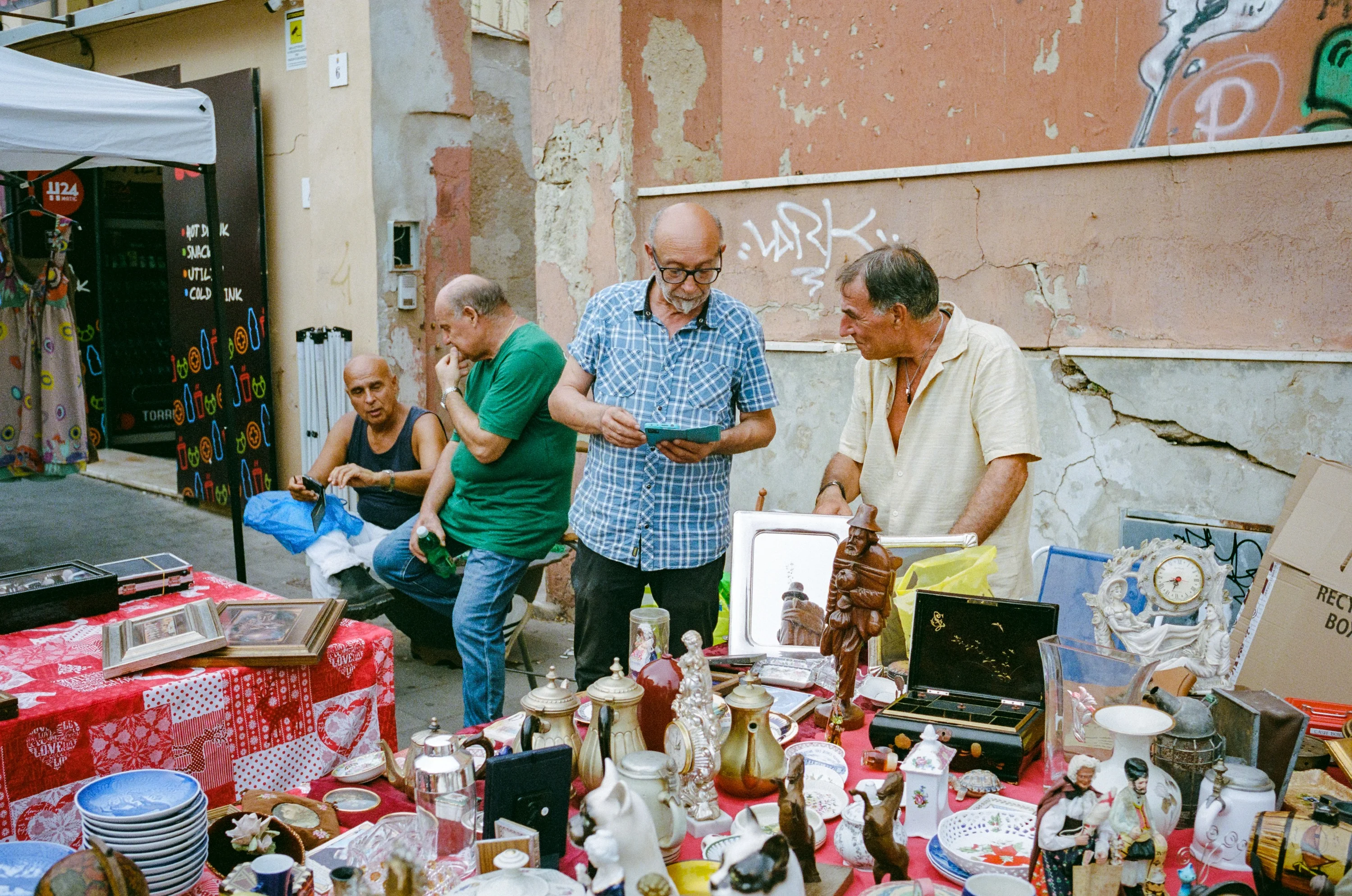 Men around a flea market stall