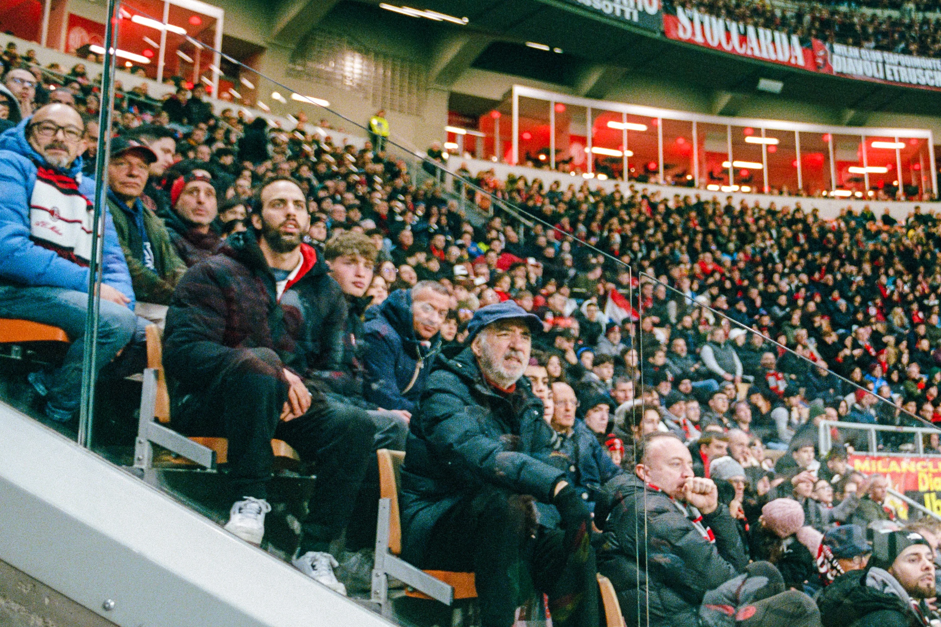 Fans in the stands at a football match