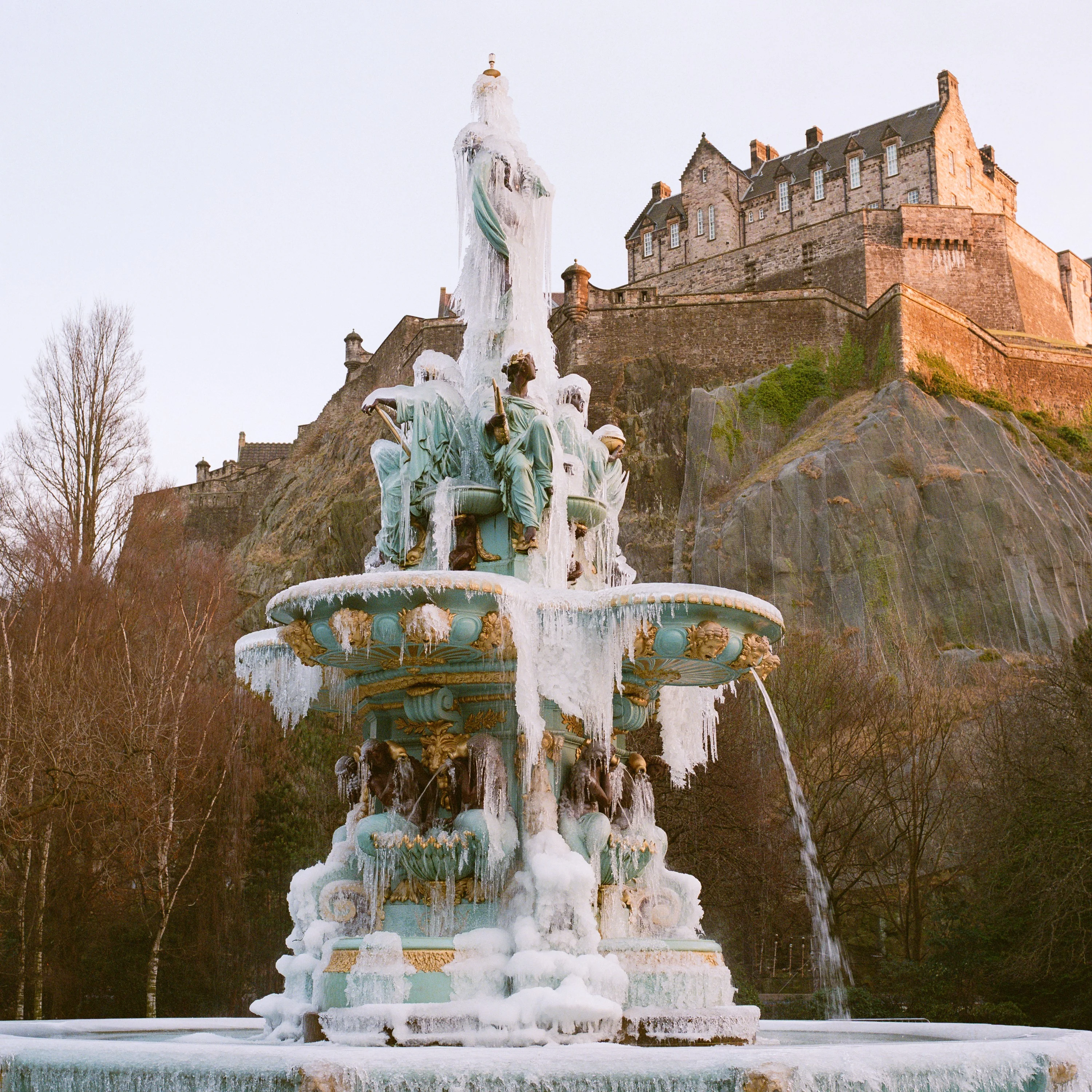 The Ross Fountain covered in ice with Edinburgh Castle behind