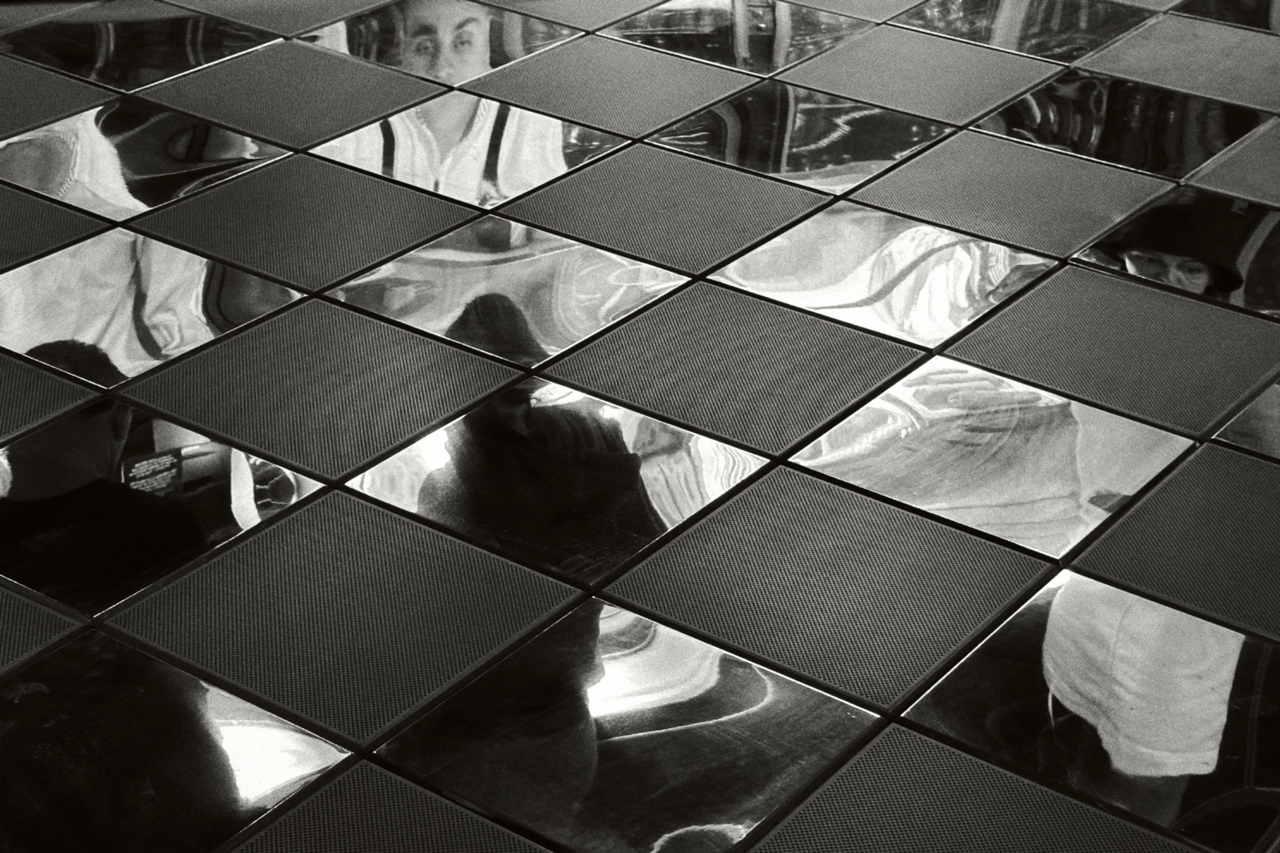 Black and white: reflective chequered floor tiles