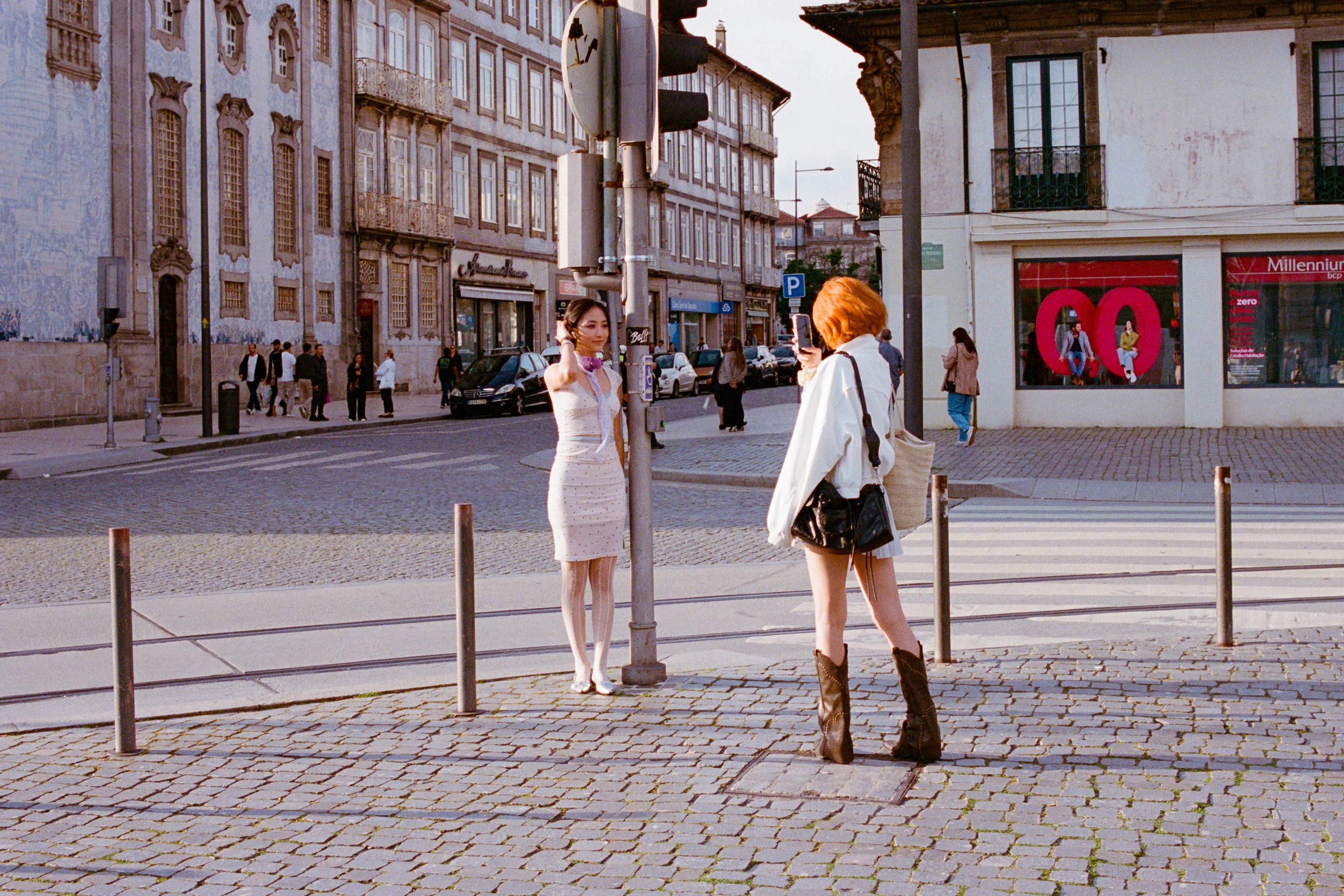 Two women crossing a street