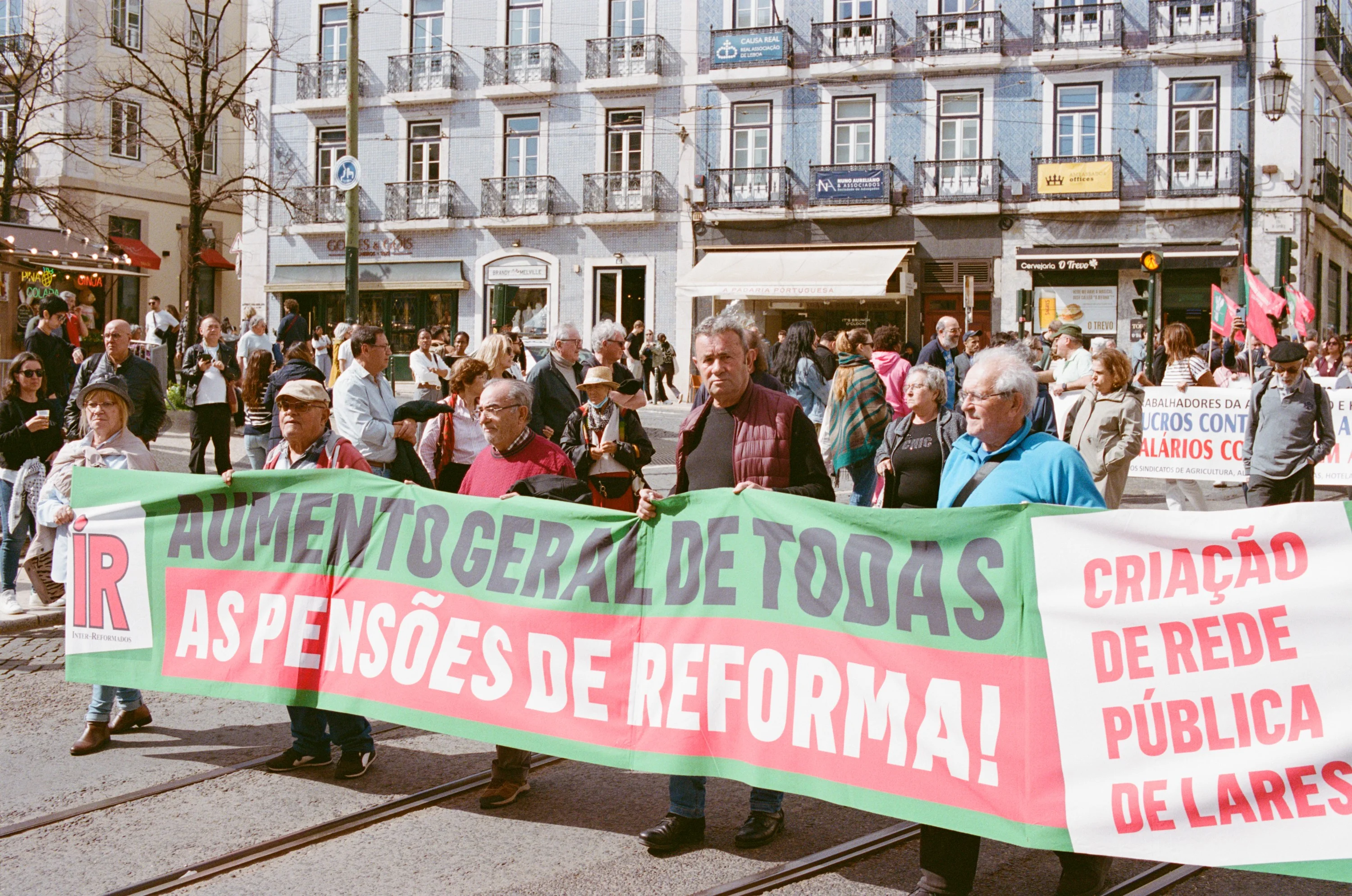 Marchers carrying a pensions banner