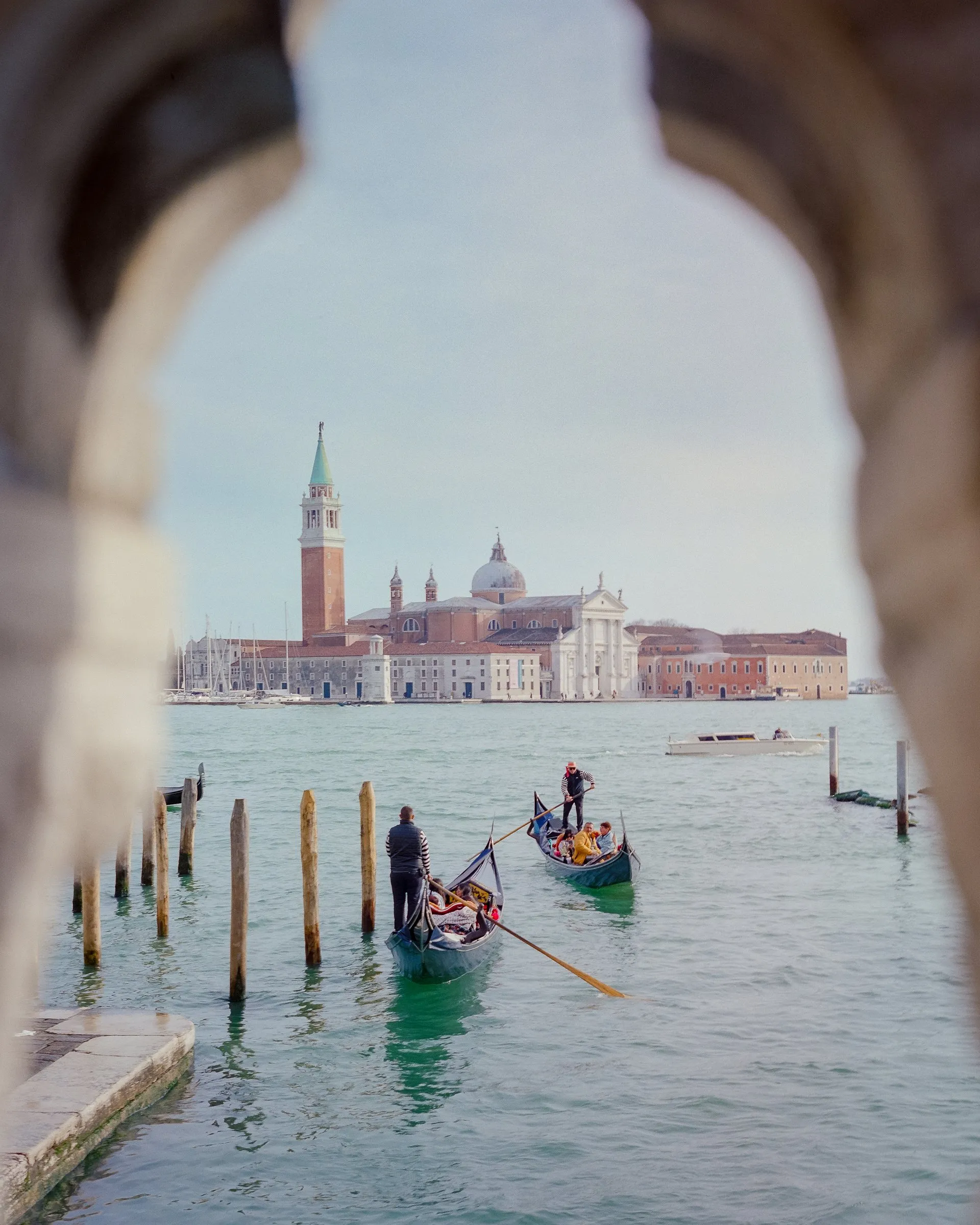 San Giorgio Maggiore seen through a stone arch across the lagoon