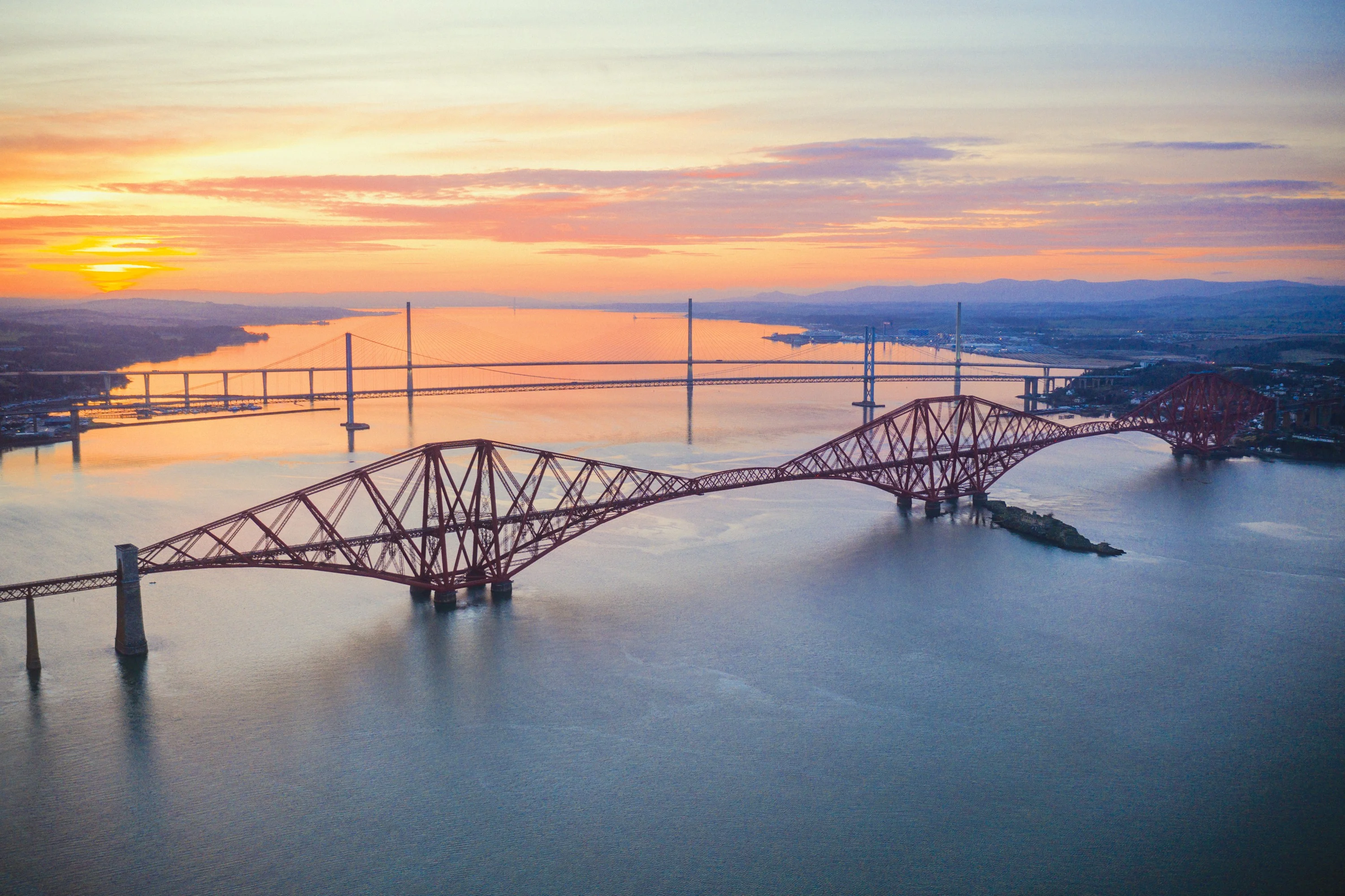 The three Forth bridges from above at sunset