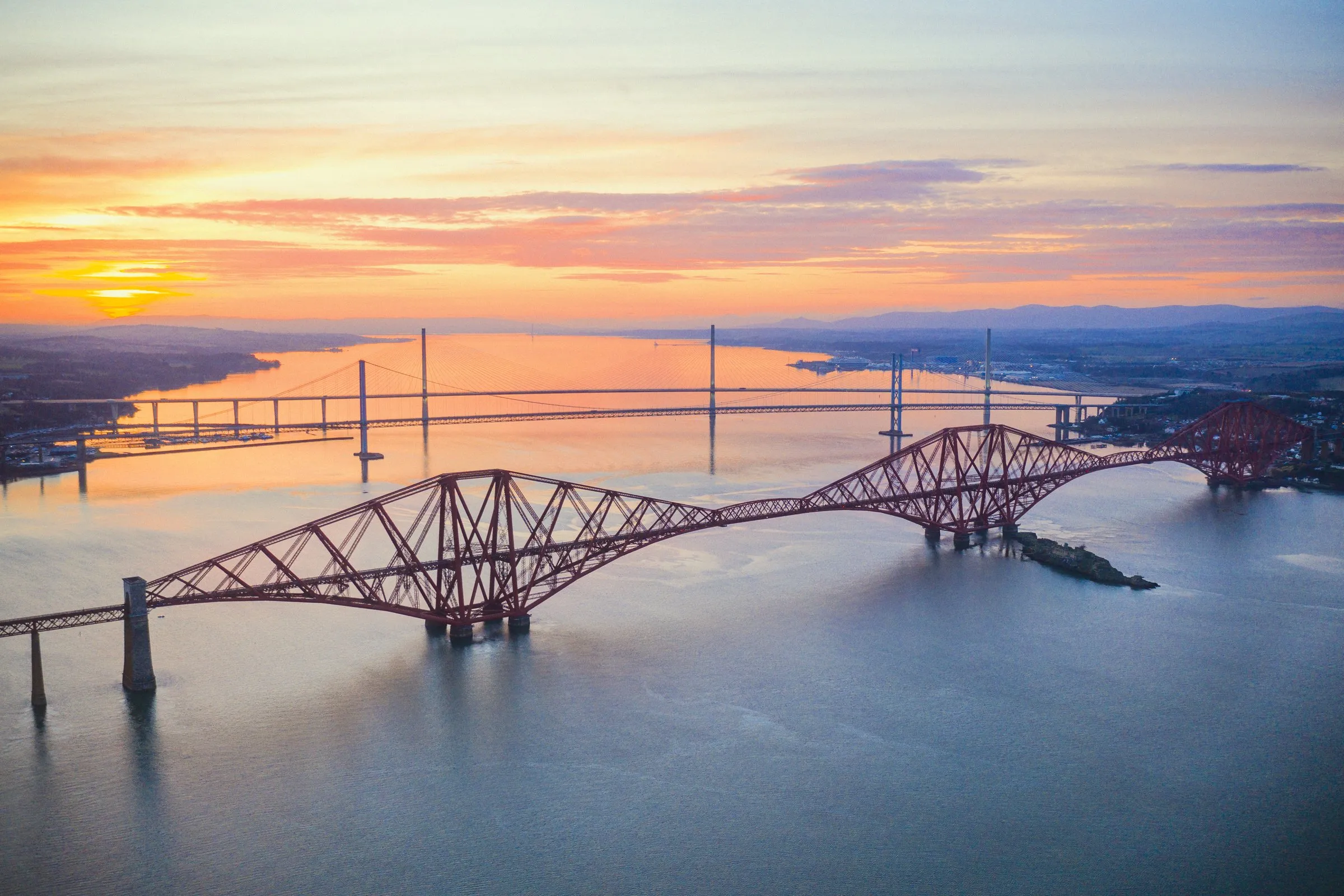 The three Forth bridges from above at sunset