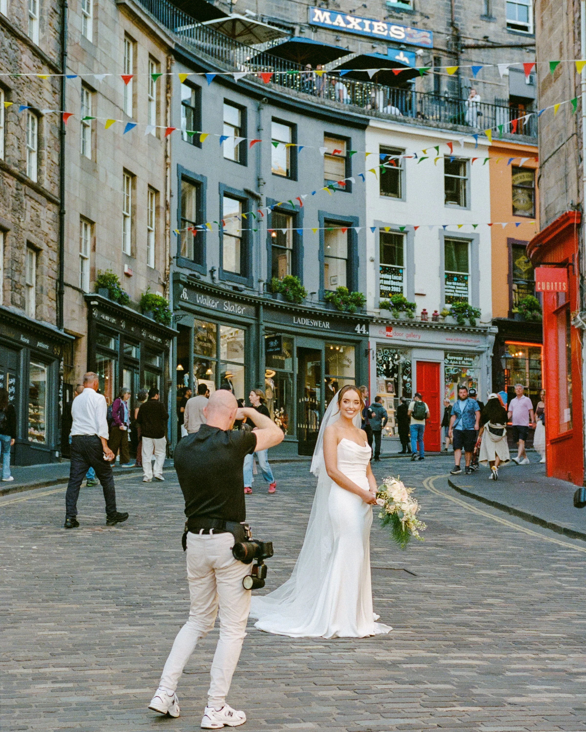 A photographer and a bride on Victoria Street
