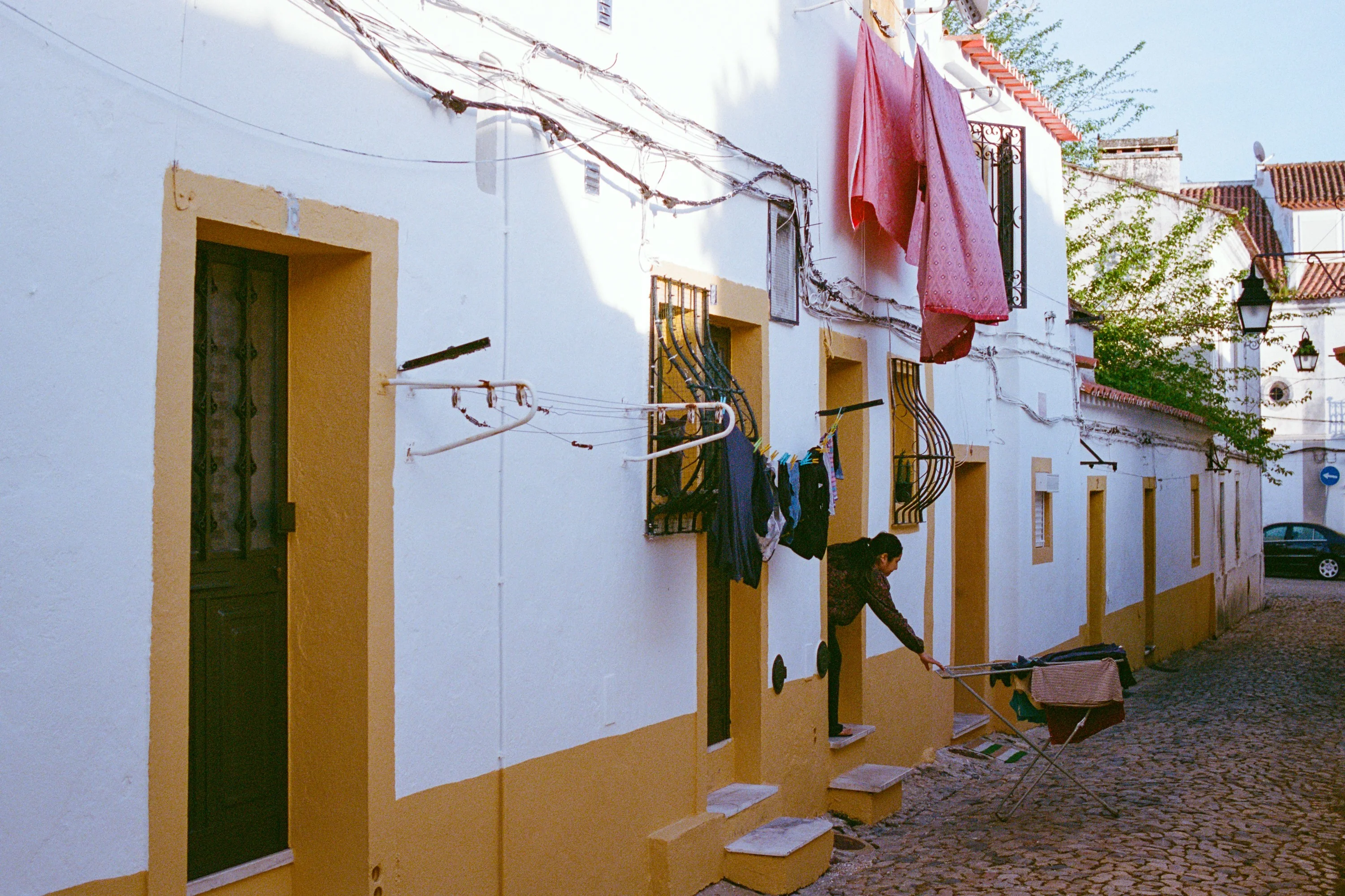 Washing hanging from a white and yellow terrace